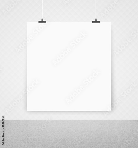 white poster on a wall