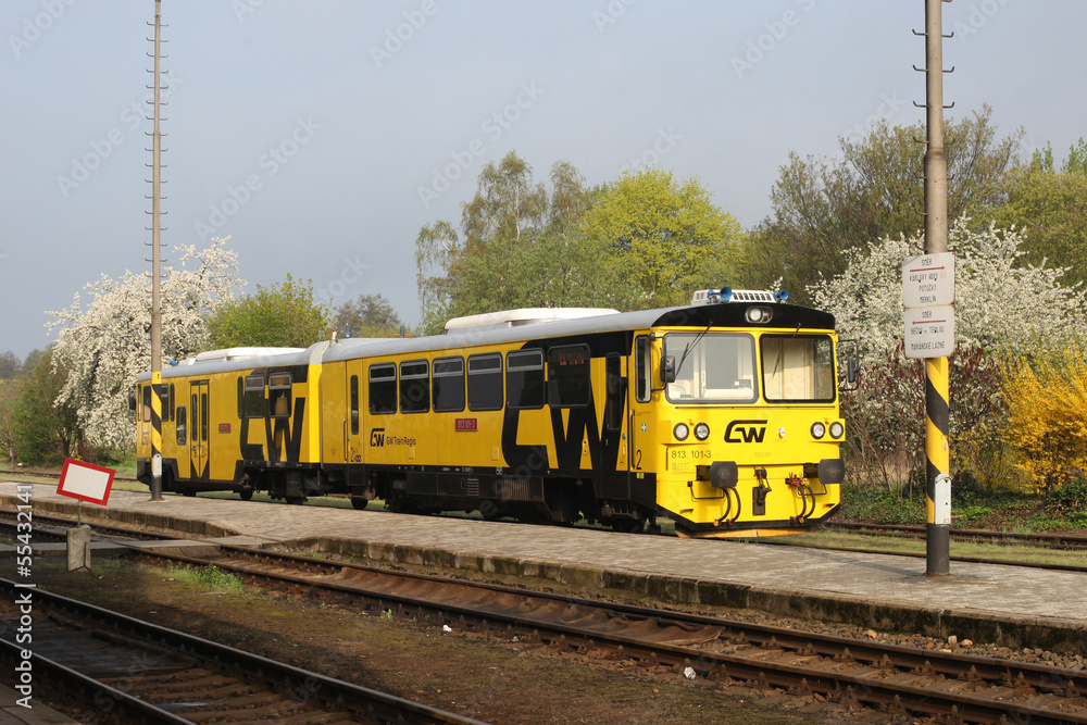 Fototapeta premium The yellow train on station, Karlovy Vary, Czech Republic
