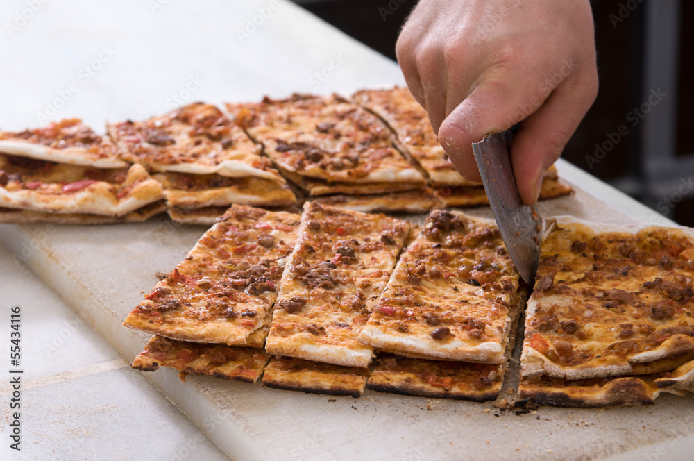Traditional Turkish pide with chopped meat called lahmacun