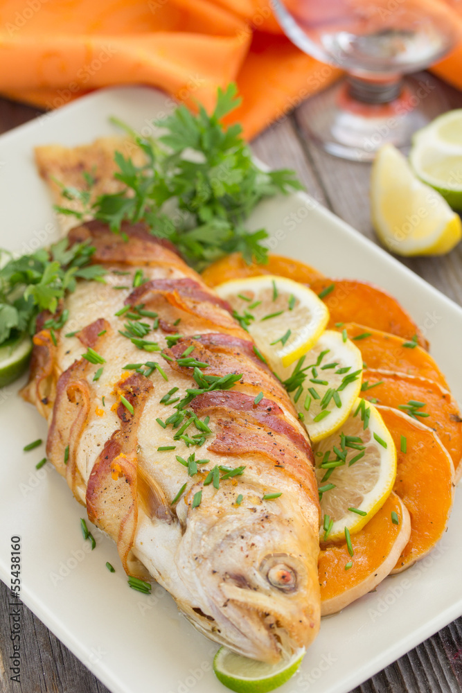 Fish (trout) baked with pumpkin and vegetables. Fish (trout) baked with pumpkin and vegetables.