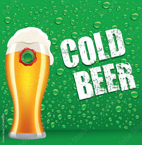 cold beer on green background with drops