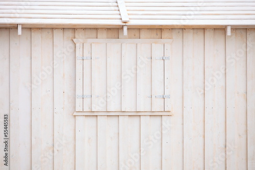 white wooden building wall on beach