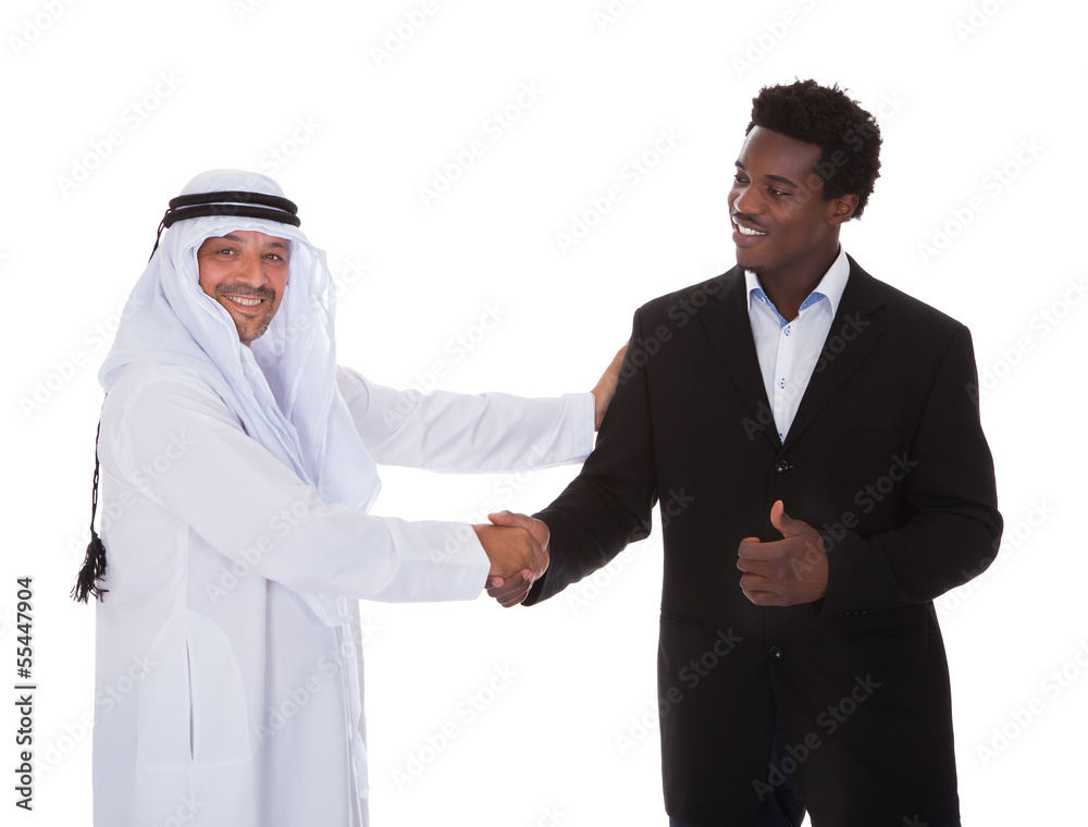 Arabic And African Man Shaking Hands
