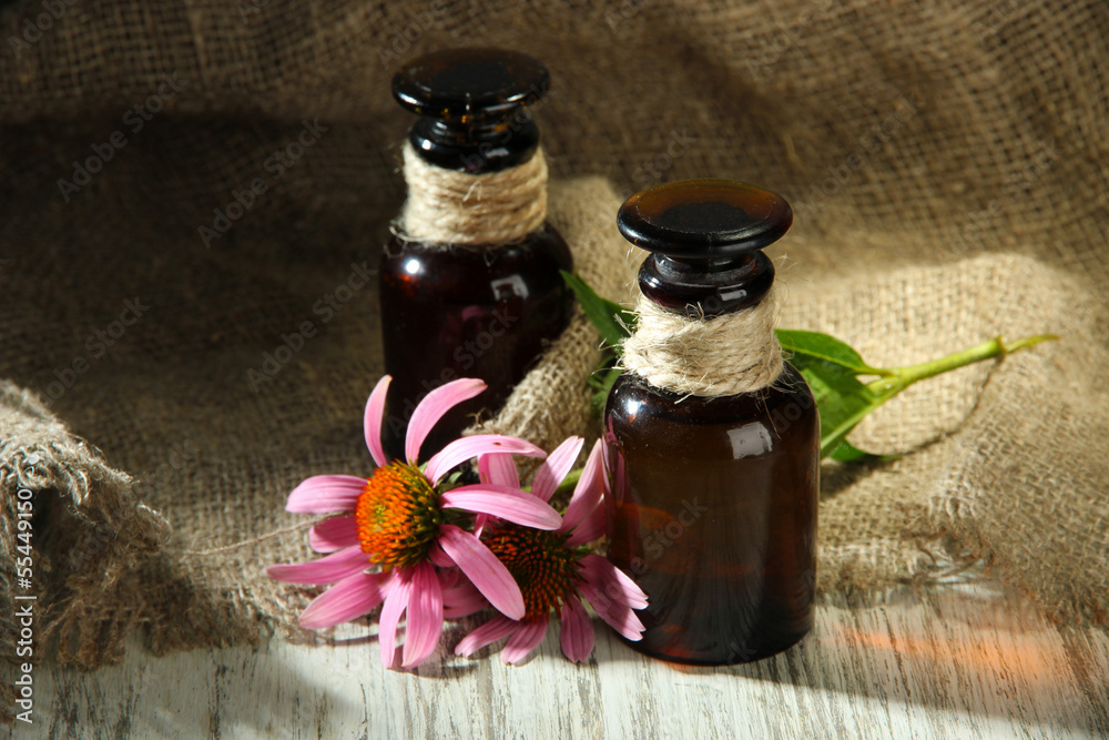 Medicine bottles with purple echinacea flowers Medicine bottles with purple echinacea flowers