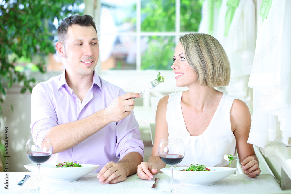 Beautiful couple having romantic dinner at restaurant Beautiful couple having romantic dinner at restaurant