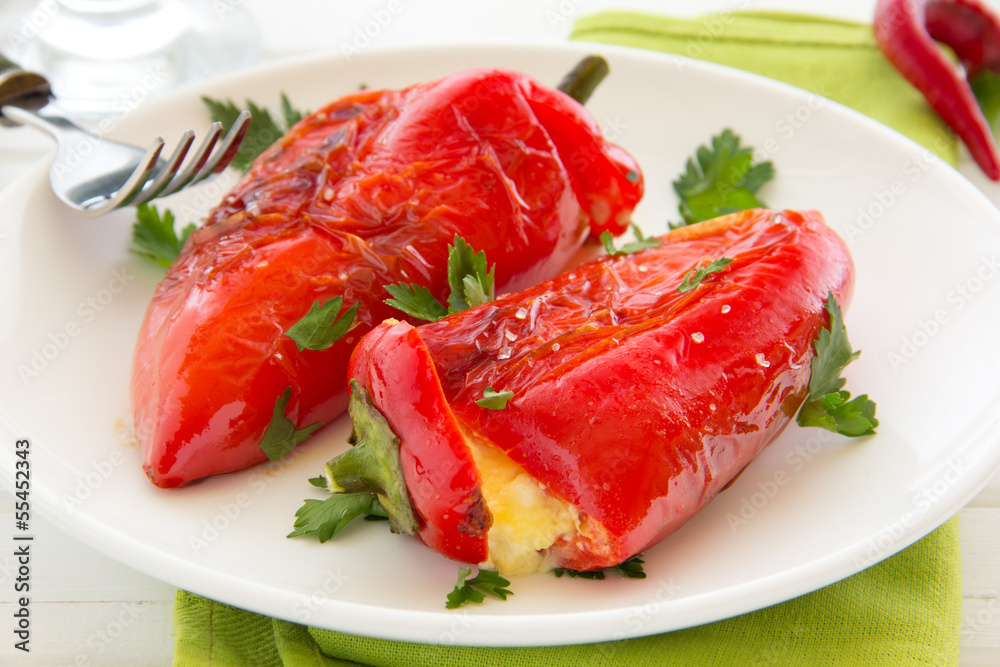 Roasted peppers stuffed with feta cheese, selective focus. Roasted peppers stuffed with feta cheese, selective focus.