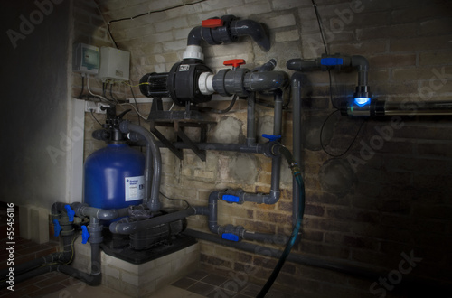 Swimming pool filtration system at basement