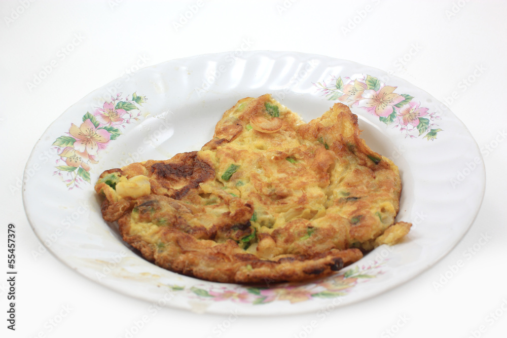 scrambled eggs with fresh herbs on a white background scrambled eggs with fresh herbs on a white background