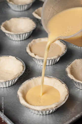 Pour the egg custard mixture into each tart cup.
