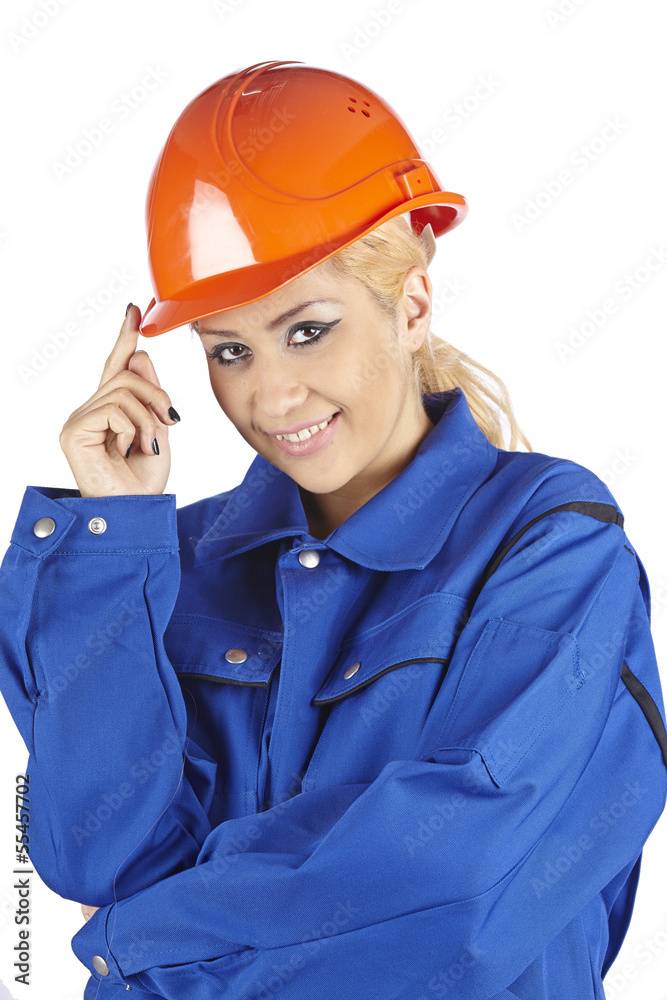 Fröhliche Handwerkerin mit Blaumann und rotem Bauhelm Fröhliche Handwerkerin mit Blaumann und rotem Bauhelm