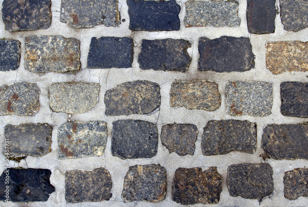 Spotted cobblestone and cement background Spotted cobblestone and cement background