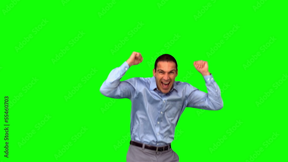 Happy businessman jumping on green screen Happy businessman jumping on green screen