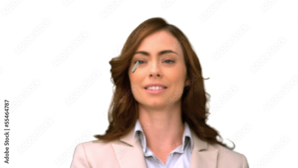 Businesswoman throwing a coin on white screen Businesswoman throwing a coin on white screen