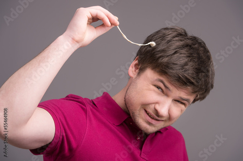 Gum in his head. Portrait of man with chewing gum in his head