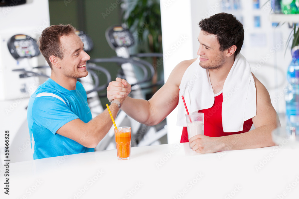 Obraz premium Healthy lifestyle. Two confident men in gym bar