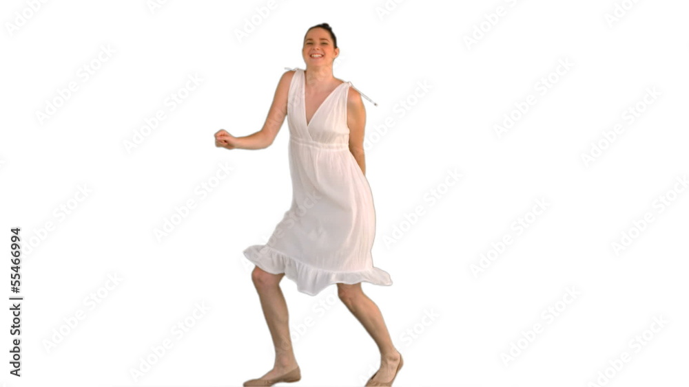 Beautiful young model in white dress dancing Beautiful young model in white dress dancing