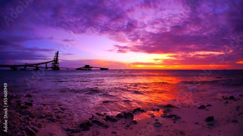 colorful stunning sunset with pier