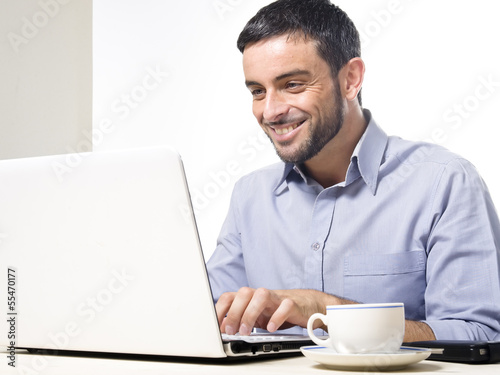 Young Man with Beard working on Laptop