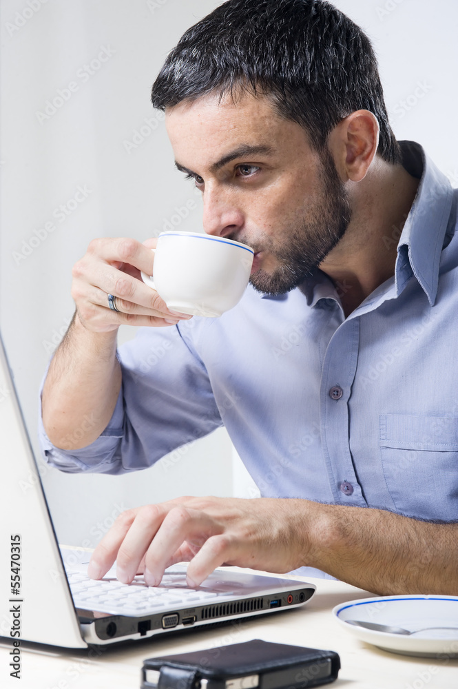 Young Man with Beard working on Laptop