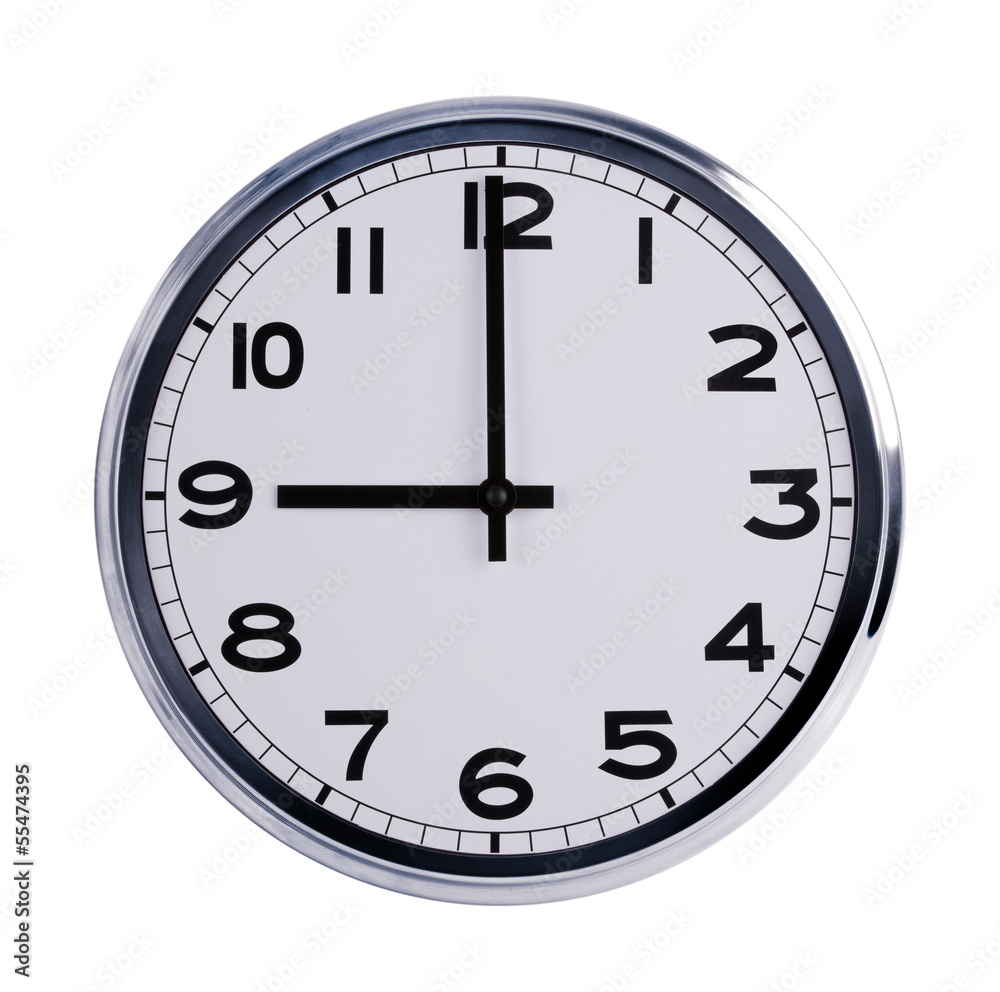Round office clock shows nine o'clock Round office clock shows nine o'clock