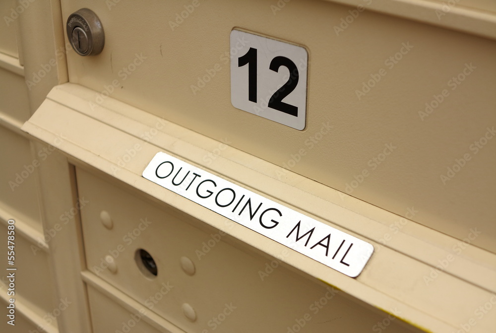 Close up of outgoing mail slot and lockable metal mailbox Close up of outgoing mail slot and lockable metal mailbox
