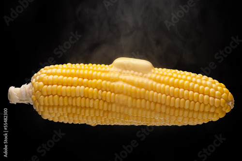 Hot corn with steam and melting butter