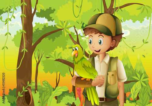 A young boyscout with a parrot