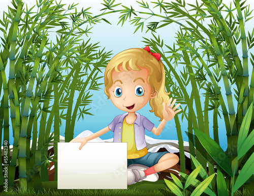 A rainforest with a young girl holding an empty signage