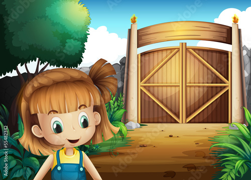 A young girl inside the gated yard