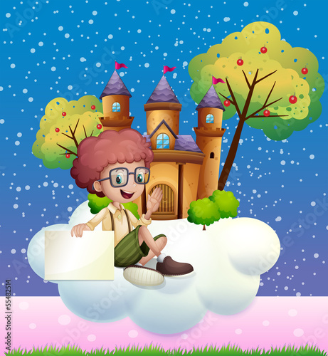 A boy sitting at the cloud holding an empty signboard