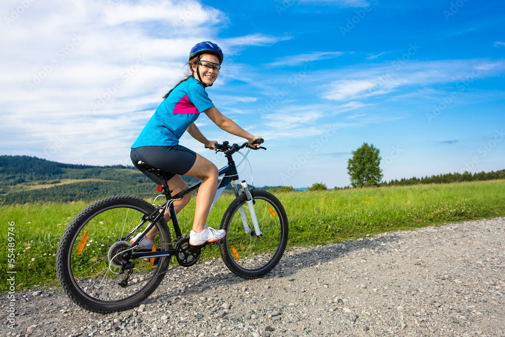 Healthy lifestyle - teenage girl biking Healthy lifestyle - teenage girl biking