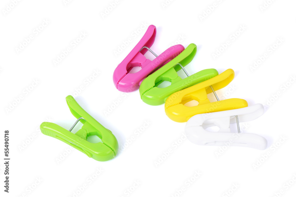 Closeup image of colorful clothespins on a white background Closeup image of colorful clothespins on a white background