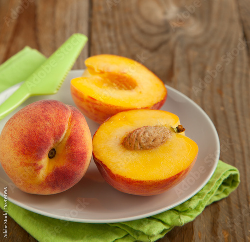 Fresh peaches on plate