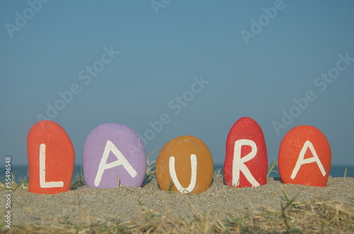 Laura, female name on colourful stones