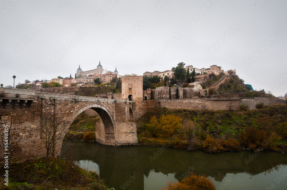 Toledo city view, with the castle and river bridge. Spain