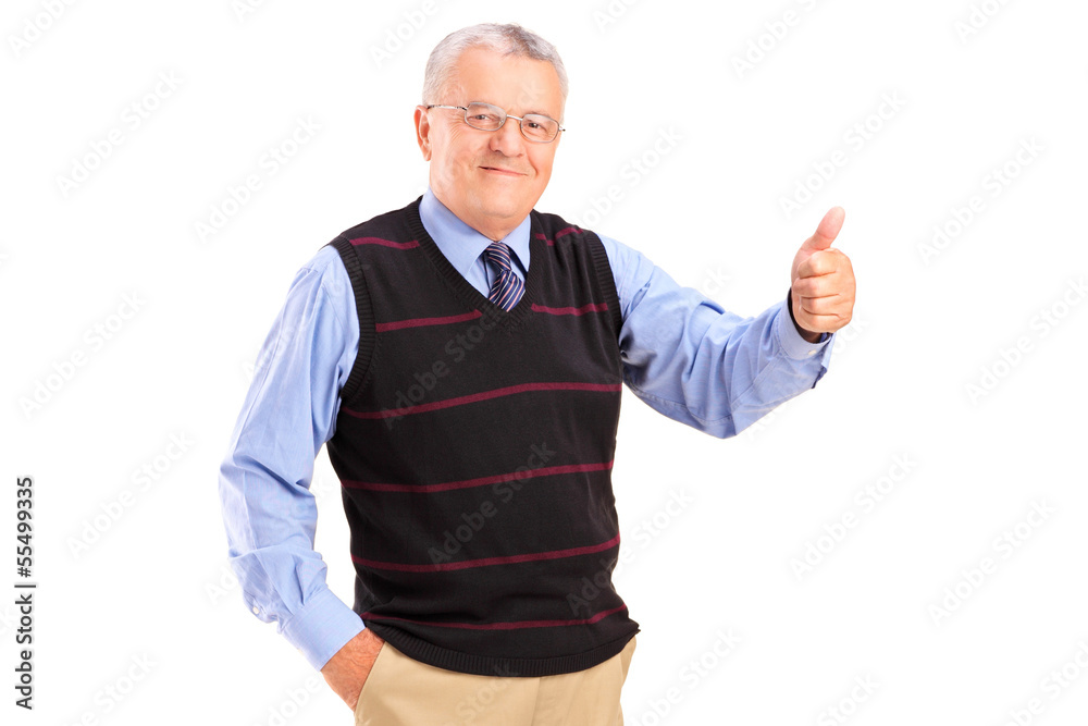 Smiling mature man giving a thumb up Smiling mature man giving a thumb up