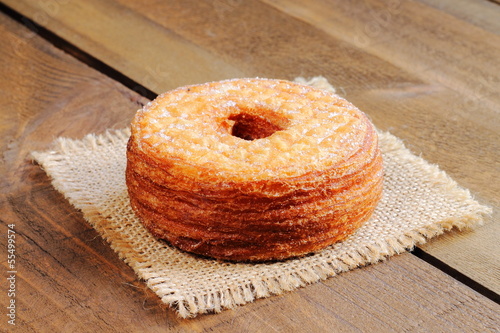 Fashionable puff pastry, half croissant and half donut photo