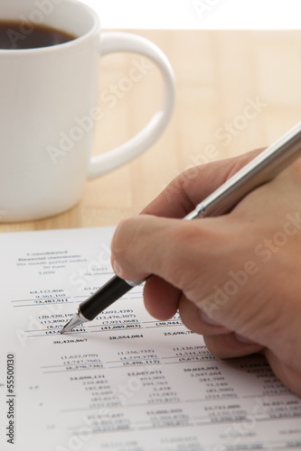 Financial report with calculator on table