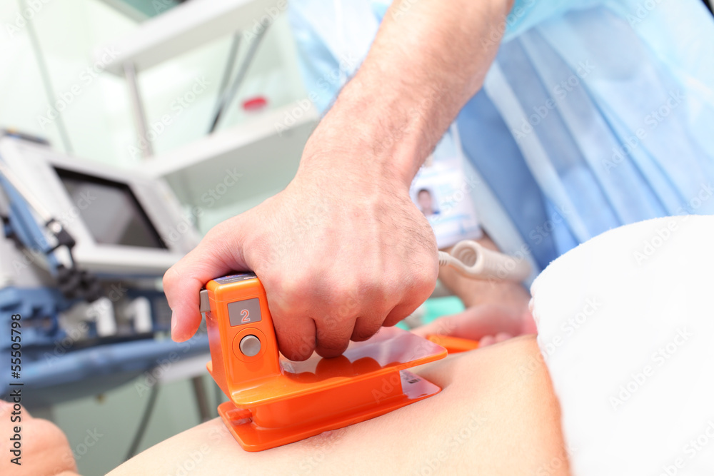 Doctor in hospital makes intensive care for a patient with a def Doctor in hospital makes intensive care for a patient with a def