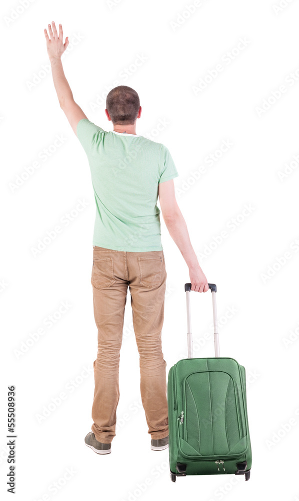 back view of man with suitcase. back view of man with suitcase.