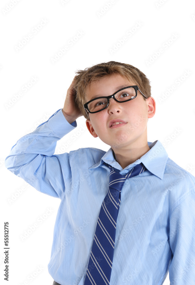 Schoolboy scratching head while thinking and looking up Schoolboy scratching head while thinking and looking up