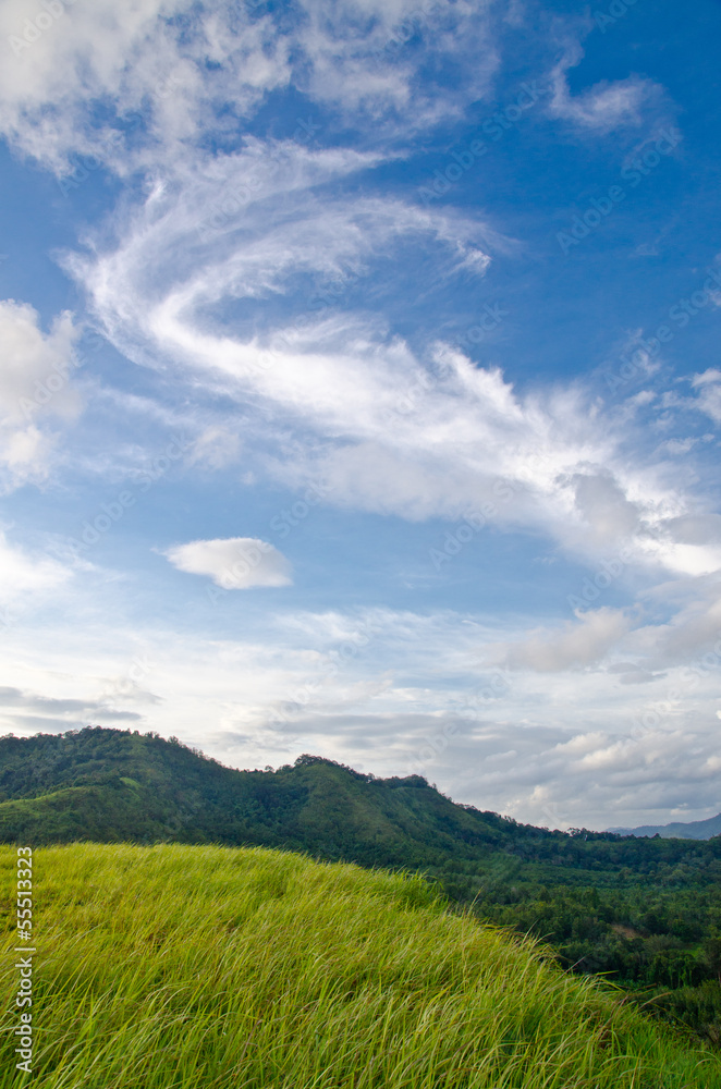 Grass Mountain and blue sky background located in Ranong, Thaila