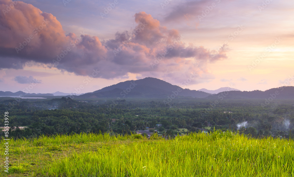 Grass Mountain and blue sky background located in Ranong, Thaila
