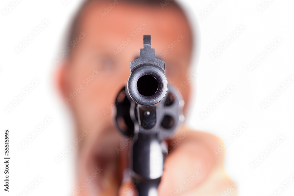A man pointing his gun revolver. Selectively concentrated on the A man pointing his gun revolver. Selectively concentrated on the