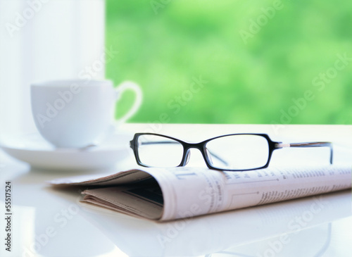 newspaper and glasses