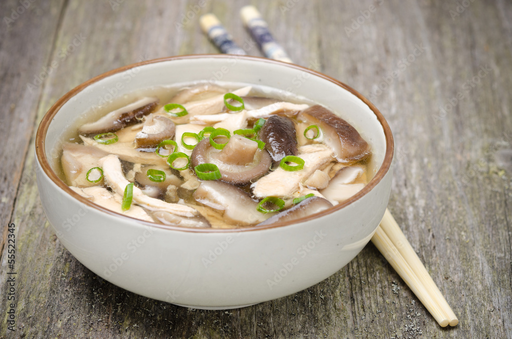 Chinese food - bowl of soup with chicken, shiitake mushrooms Chinese food - bowl of soup with chicken, shiitake mushrooms