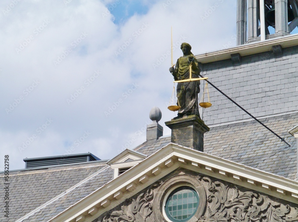 Fototapeta premium A statue of lady justice with the sword and the balance scales