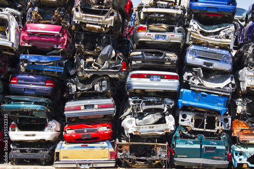 Discarded Junk Cars Piled Up After Crushing photo