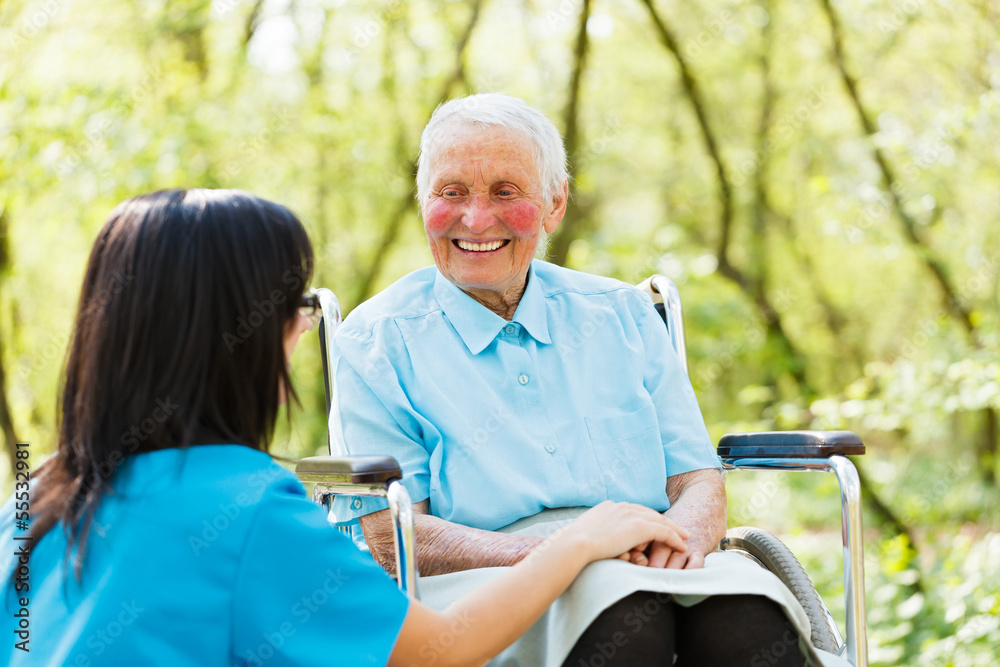 Obraz premium Smiling Lady in Wheelchair