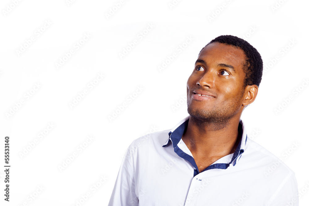 Young man looking up over white background Young man looking up over white background